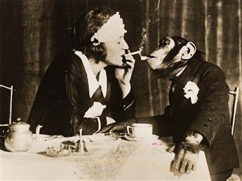 (HOLY SMOKE!) A selection of 27 photographs of people and animals smoking from glamorous flappers to pipe-smoking canines.